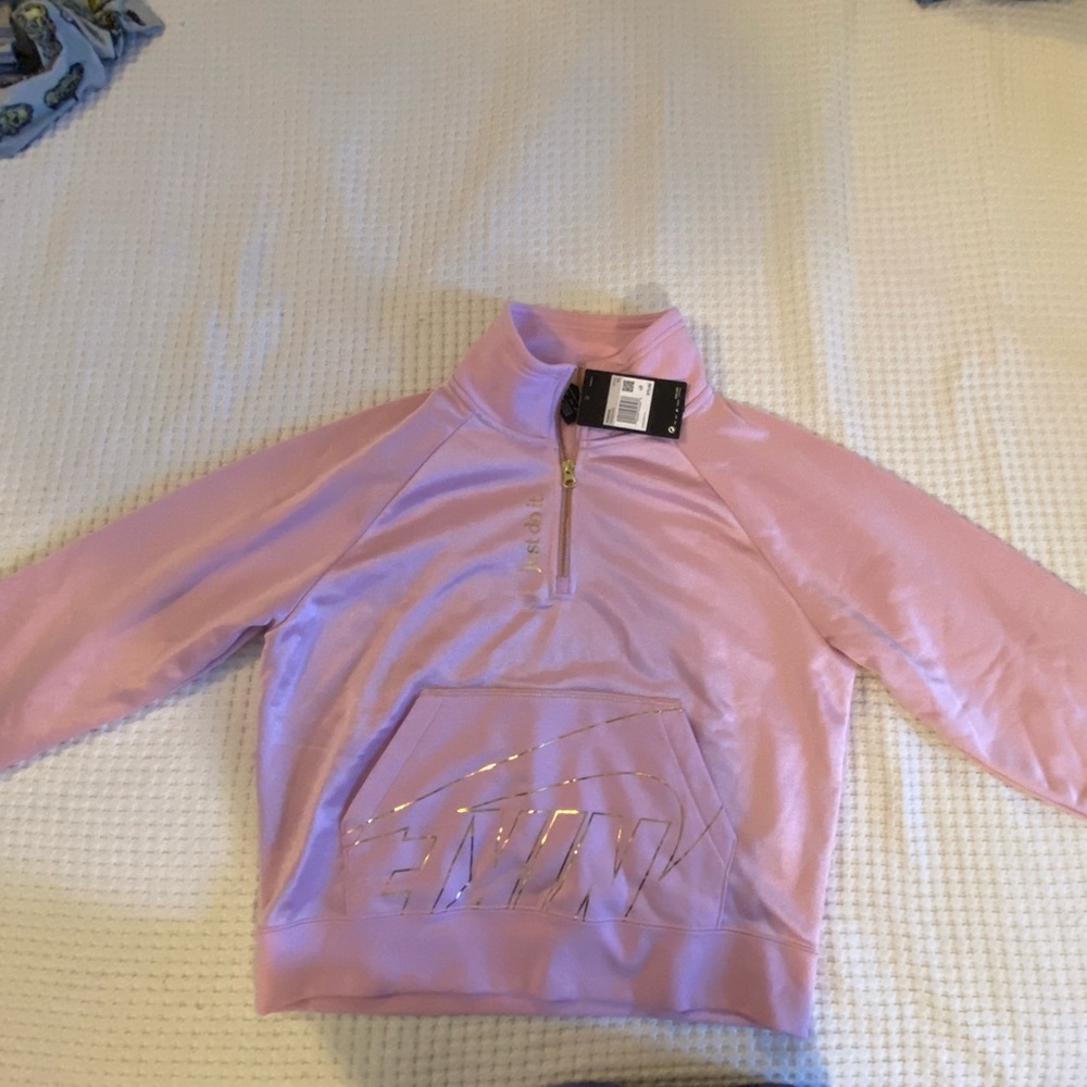 New with tags. Nike pink and gold 3/4 zip fleece. Size XS